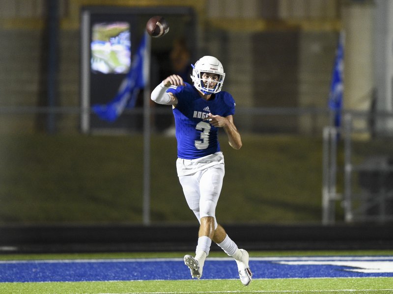 High School quarterback Hunter Loyd (3) throws a pass during a football game, Friday, September 13, 2019 at Rogers High School in Rogers.