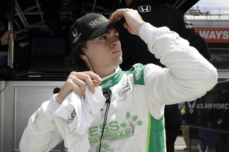 FILE - In a Tuesday, May 14, 2019 file photo, Colton Herta looks at his practice results during a practice session for the Indianapolis 500 IndyCar auto race at Indianapolis Motor Speedway, in Indianapolis. Herta is closing in on a deal to be pulled inside the Andretti Autosport camp as IndyCar drivers are getting a jump on their 2020 plans. (AP Photo/Darron Cummings, File)