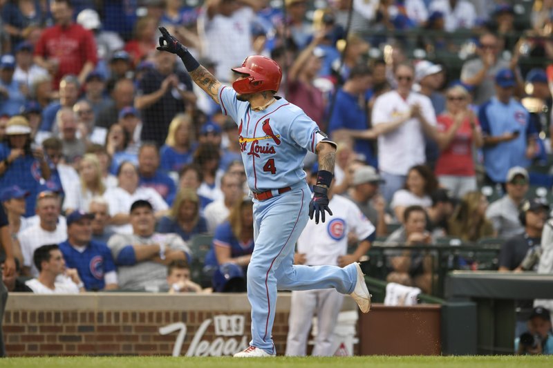 St. Louis Cardinals' Yadier Molina celebrates while rounding the bases after hitting a solo home run during the ninth inning of baseball game against the Chicago Cubs Saturday, Sept. 21, 2019, in Chicago. (AP Photo/Paul Beaty)