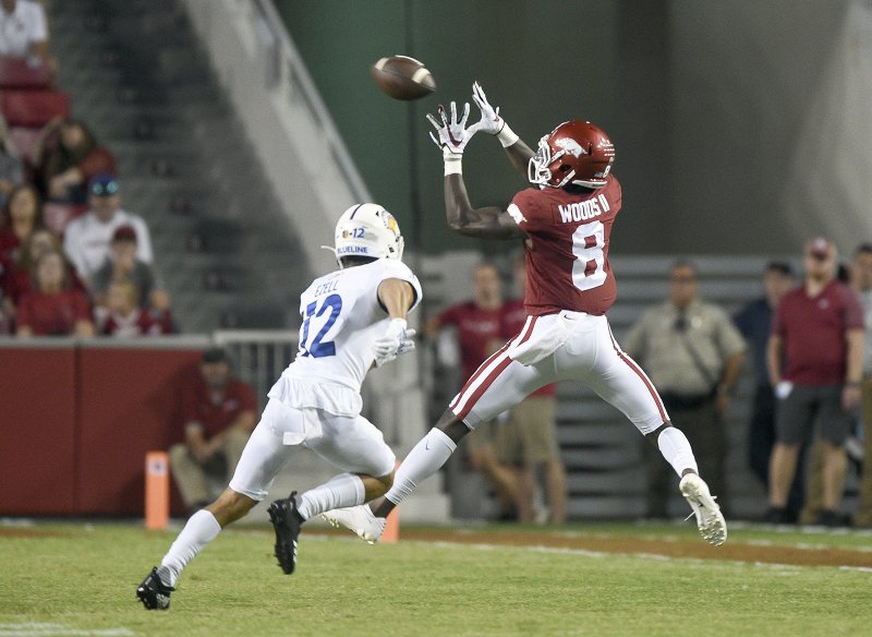 NWA Democrat-Gazette/Charlie Kaijo SPECTACULAR CATCH: Arkansas Razorbacks wide receiver Mike Woods (8) makes a catch during the second quarter of Saturday game at Donald W. Reynolds Razorback Stadium in Fayetteville. The Razorbacks lost to the Spartans 31-24.