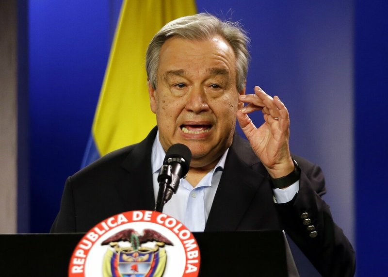 FILE - Jan. 13, 2018 file photo, U.N. Secretary-General Antonio Guterres talks to the media during a join declaration with the Colombian president, in Bogota, Colombia. Saying humanity is waging war with the planet, the head of the United Nations isn't planning to let just any world leader speak about climate change in Monday's special "action summit." Guterres says only those with new specific and bold plans can command the podium and the ever-warming world's attention. (AP Photo/Fernando Vergara, File)