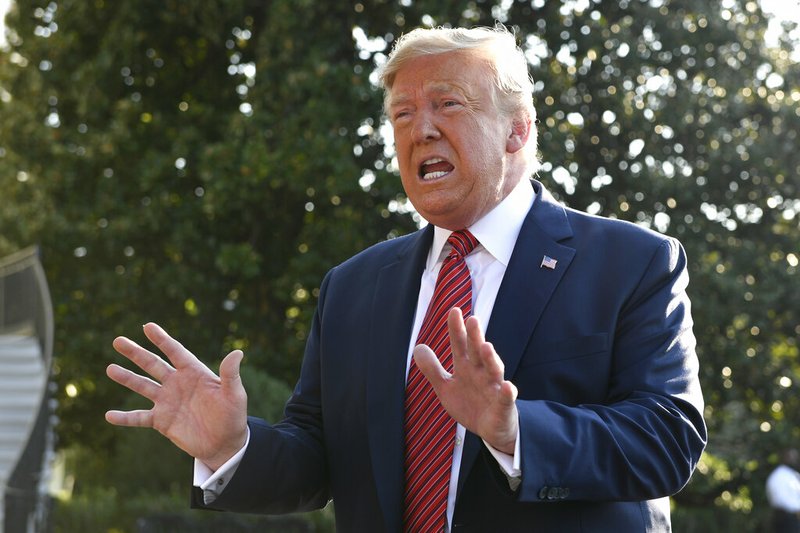 President Donald Trump talks with reporters on the South Lawn of the White House in Washington, Sunday, Sept. 22, 2019, as he prepares to board Marine One for the short trip to Andrews Air Force Base. Trump is traveling to Texas and Ohio before heading to New York for the upcoming United Nations General assembly.