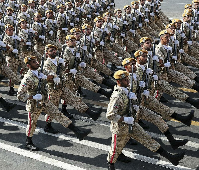 Iranian troops march Sunday during a military parade held outside Tehran to mark the 39th anniversary of the start of the Iran-Iraq war.