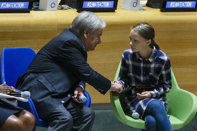 Swedish environmental activist Greta Thunberg (right) meets with U.N. Secretary-General Antonio Guterres on Saturday during the Youth Climate Summit at United Nations headquarters in New York. 