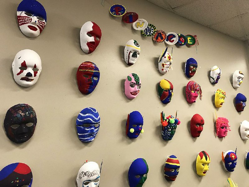 Masks created by day treatment clients at Pinnacle House are on display at the center for people with mental-health issues. Its operator, Little Rock Community Mental Health Center, is shutting down after more than 50 years. There are more than 90 behavioral health providers in Pulaski County, but advocates say the loss of such a long-established center opens a gap in the treatment landscape. 