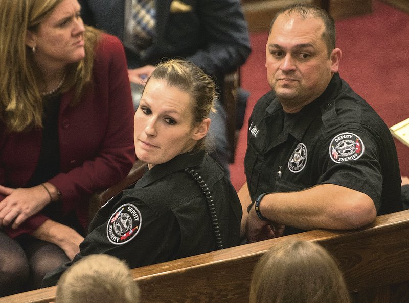 File Photo/NWA Democrat-Gazette/J.T. WAMPLER 
Robin Holt (LEFT) and Jeremy Guyll look in November 2015 at the crowd to watch their grievance hearing against then-Sheriff Kelley Cradduck. Both claim Cradduck demoted them because they cooperated with an Arkansas State Police investigation. 