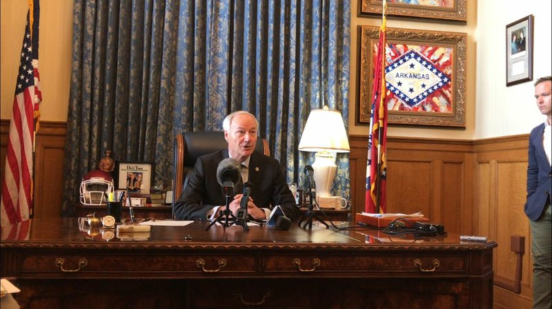 In this file photo Arkansas Gov. Asa Hutchinson is shown addressing reporters on Sept. 23, 2019  in his office at the state Capitol in Little Rock. 