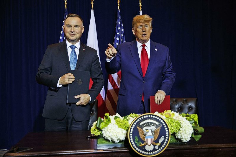 President Donald Trump and Polish President Andrzej Duda face reporters Monday after signing a joint defense declaration agreement at New York’s InterContinental Barclay hotel during the United Nations General Assembly. 