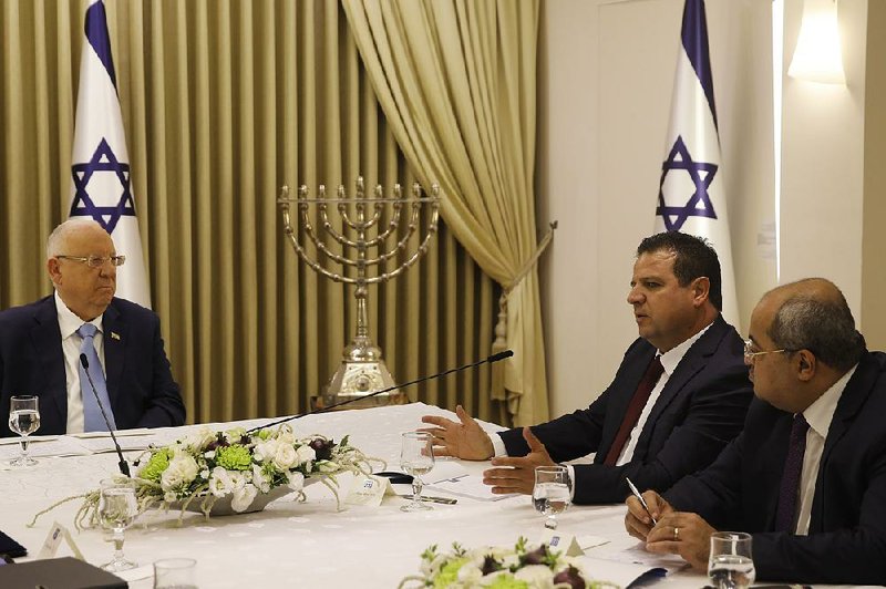 Israeli President Reuven Rivlin (from left) listens to Ayman Odeh and Ahmad Tibi, members of the Joint List alliance, during a meeting Sunday in Jerusalem. Rivlin spent two days consulting with leaders from all of the parties elected to parliament.