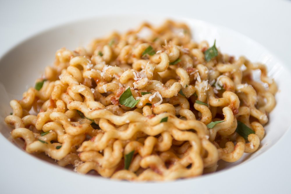 Marcella Hazan's Butter Tomato Sauce with parsley and parmesan with long fusilli bucati pasta
Photo by Jeff Gammons