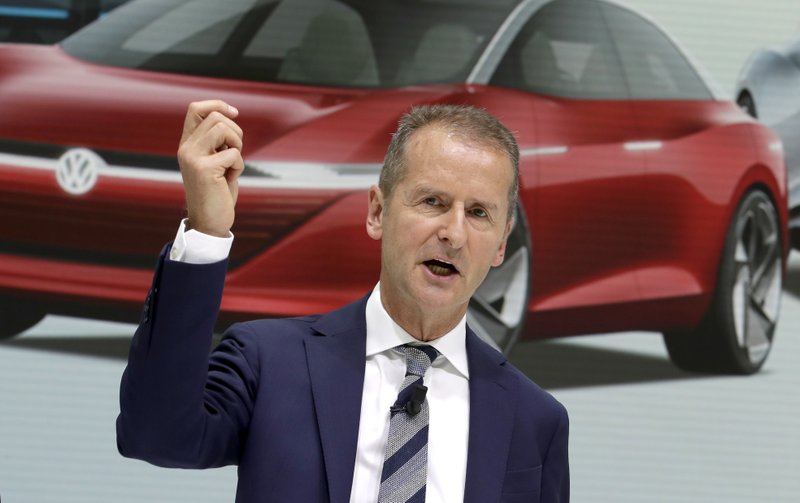 In this Aug. 1, 2018 file photo Herbert Diess, CEO of the Volkswagen car maker company, addresses the media during a press conference in Wolfsburg, Germany. (AP Photo/Michael Sohn, file)