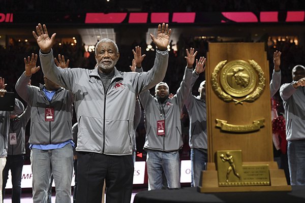 Former Arkansas coach Nolan Richardson calls the hogs with members of the 1994 Razorback National Championship basketball team during half time of an NCAA college basketball game, Saturday, March 2, 2019 in Fayetteville. The ceremony marked the 25-year anniversary of the National Championship game. (AP Photo/Michael Woods)

