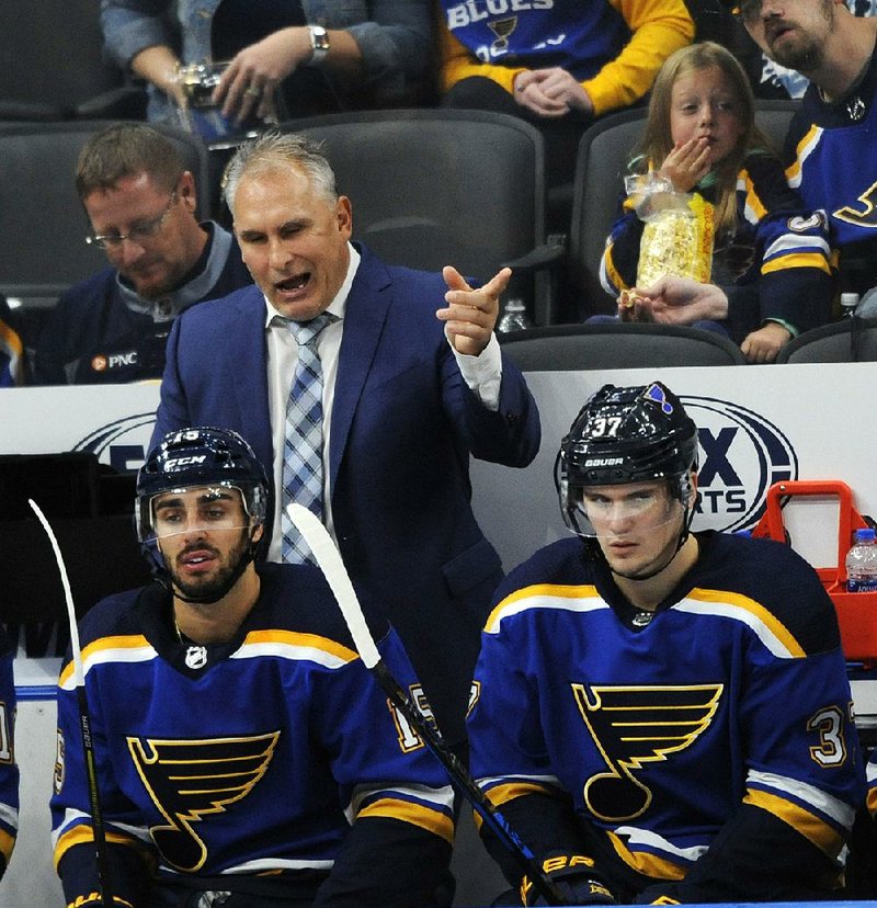 Coach Craig Berube (back) and the St. Louis Blues had their ups and downs during the regular season last year, but they got hot at the right time and won the Stanley Cup in the process. 