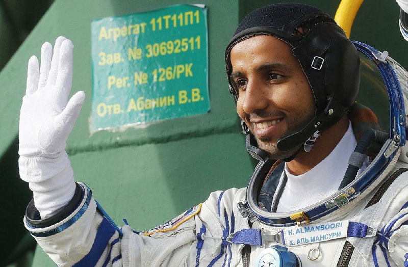 Hazzaa al-Mansoori boards a Soyuz space capsule Wednesday at the Baikonur cosmodrome in Kazakhstan for a flight to the International Space Station along with Jessica Meir of NASA and Oleg Skripochka of Russia. More photos are available at arkansasonline.com/926astronaut/ 