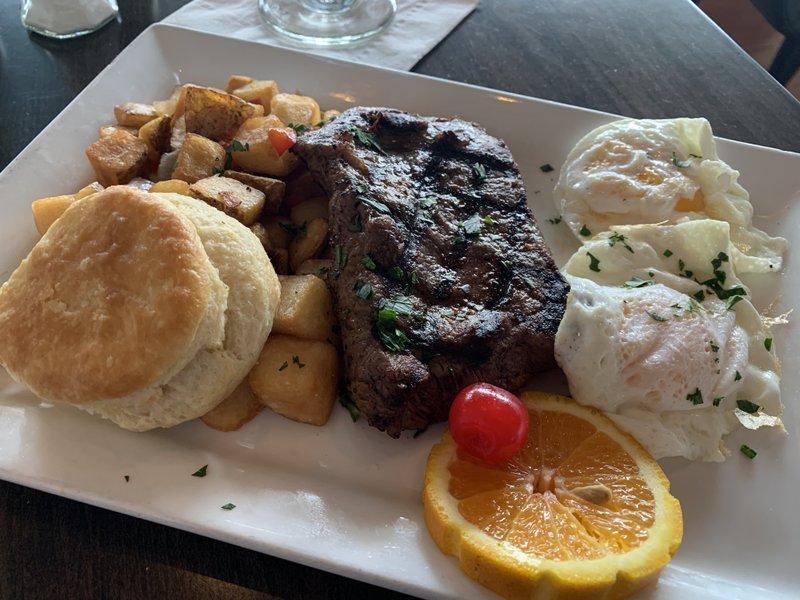Steak and Eggs come with home-fried potatoes for brunch at 42 bar and table, on the lower level of the Clinton Presidential Center. Arkansas Democrat-Gazette/Eric E. Harrison