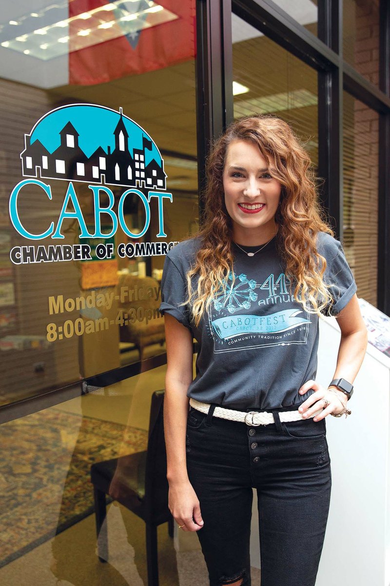 Kelly Tamburo won the T-shirt-design contest for the Cabot Chamber of Commerce’s CabotFest. Tamburo, pictured wearing the winning design, is new to Cabot and said she has been thankful for the welcoming spirit of the city and its residents.