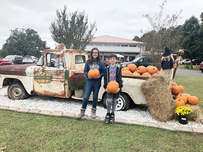 Allison and Dylan Cleveland hold pumpkins they picked at the Arkansas Sheriffs’ Youth Ranch in 2018. The Clevelands are the children of Matt Cleveland, chief development officer for Arkansas Sheriff’s Youth Ranch in Batesville. The pumpkin patch will open Tuesday and continue through Oct. 30.