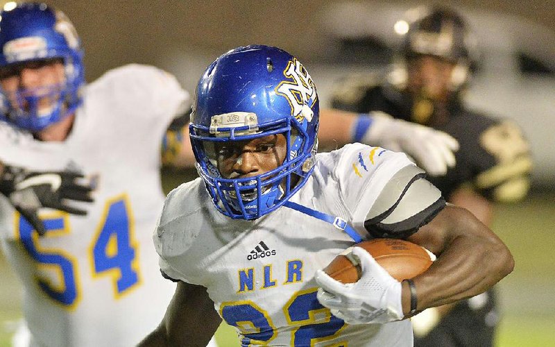 North Little Rock running back Brandon Thomas looks for room during Friday night’s game against Little Rock Central at Quigley-Cox Stadium in Little Rock. See more photos at arkansasonline.com/galleries. 