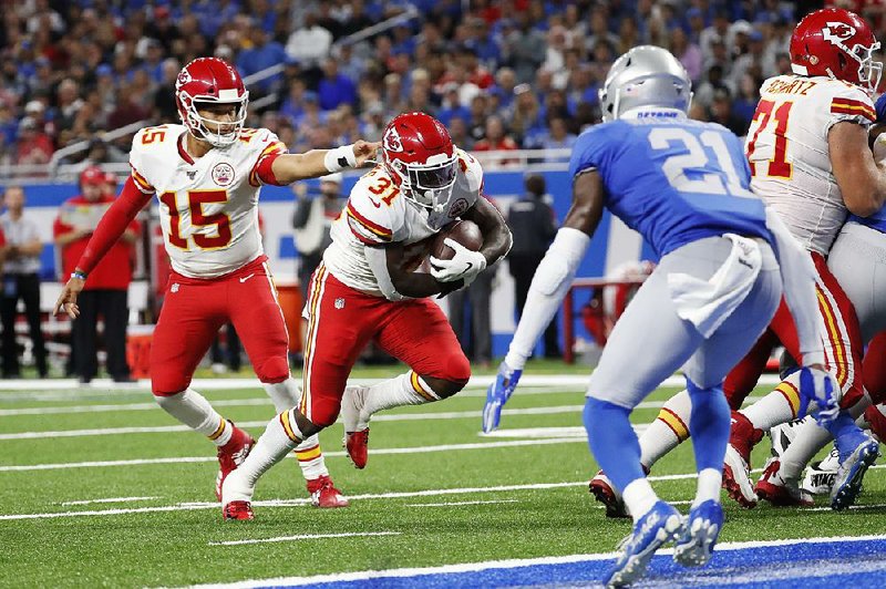 Chiefs score late to remain undefeated