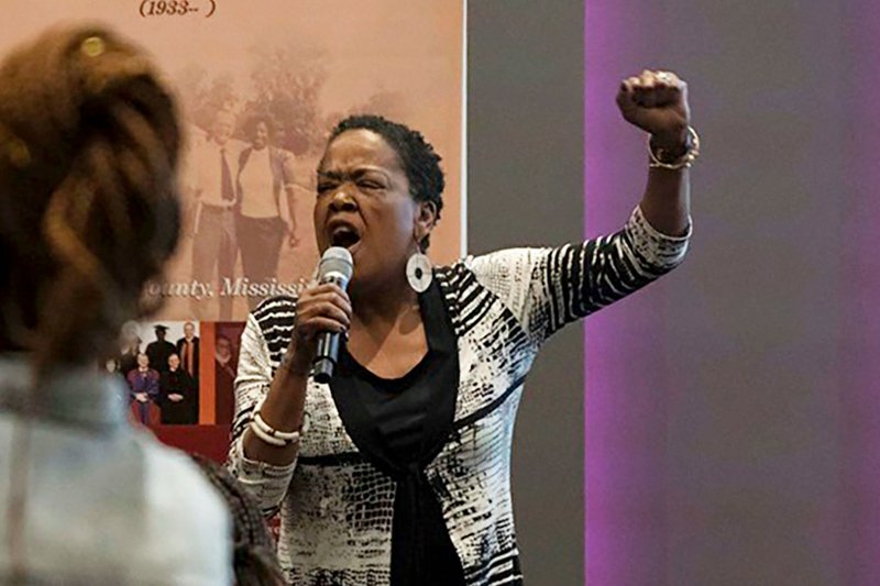 In this June 20, 2019 photo provided by Meredith Williams, Jaribu Hill speaks at the Mississippi Civil Rights Museum in Jackson, Miss., during a reception honoring the life of civil rights activist Unita Blackwell. Hill didn't opt for law school until her early 40s. She&#x2019;d been a singer, actress, teacher and labor organizer before learning a college classmate had become head of a group for black female judges. &#x201c;I can do that, too,&#x201d; she thought. Hill has since become a leading civil rights and workers' rights lawyer in Mississippi and now, at 70, she&#x2019;s part of a nationwide network of attorneys helping women without much money pursue often-costly sexual misconduct cases. (Meredith Williams via AP)