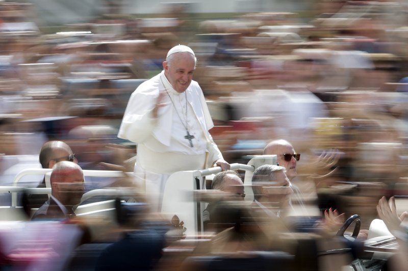 Pope Francis greets faithful after celebrating Mass on the occasion of the Migrant and Refugee World Day, in St. Peter's Square, at the Vatican, Sunday, Sept. 29, 2019. (AP Photo/Andrew Medichini)