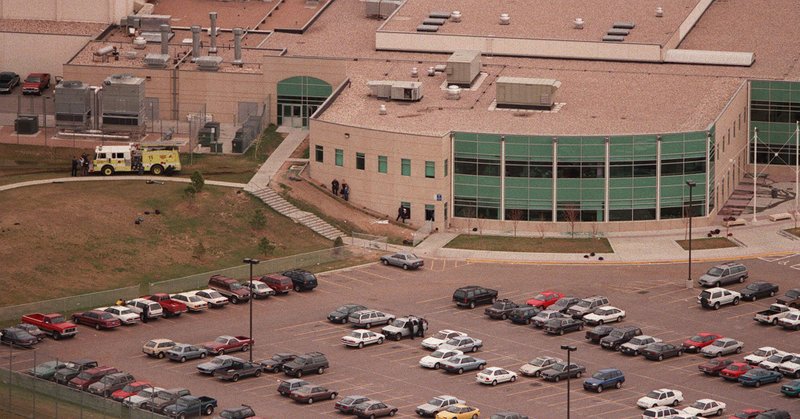 An aerial view shows SWAT members outside Columbine High School in Littleton, Colo., on Tuesday, April 20, 1999. (AP Photo/Denver Rocky Mountain News, Rodolofo Gonzalez)