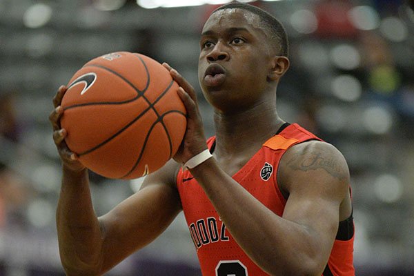 Davonte Davis (3) shoots Friday, April 12, 2019, during play at Fayetteville High School.
