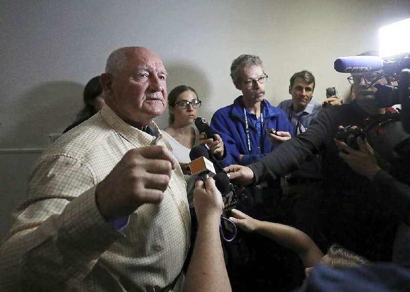 U.S. Secretary of Agriculture Sonny Perdue (left) speaks Tuesday after a town-hall-style meeting at the World Dairy Expo in Madison, Wis. 