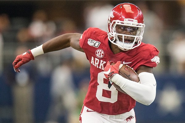 Mike Woods, Arkansas wide receiver, picks up yards after a catch in the third quarter vs Texas A&M Saturday, Sept. 28, 2019, at AT&T Stadium in Arlington, Texas.