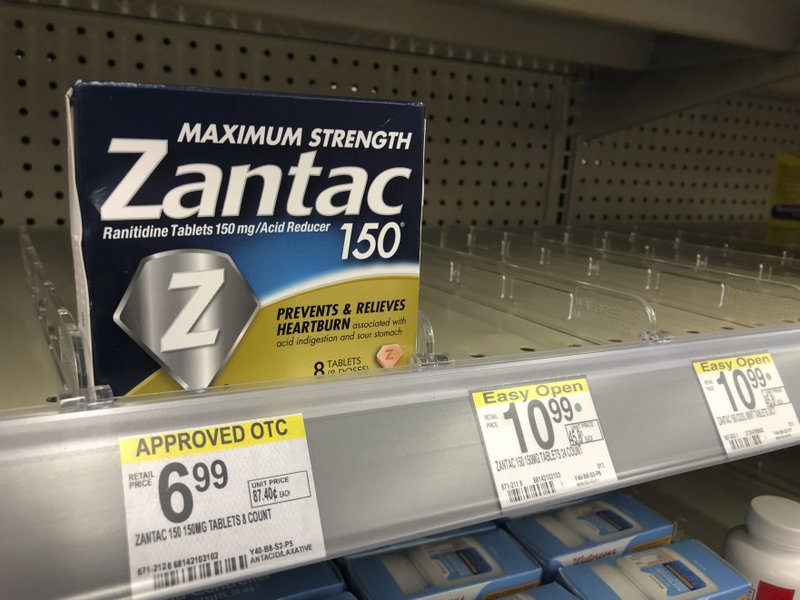 FILE - In this Sept. 30, 2019, file photo a box of Maximum Strength Zantac tablets is shown at a pharmacy in Miami Beach, Fla. Walmart has become the latest store to halt sales of the popular heartburn treatment Zantac after health regulators warned about a potentially dangerous contaminant in the drug. (AP Photo/Wilfredo Lee, File)
story.lead_photo.caption
