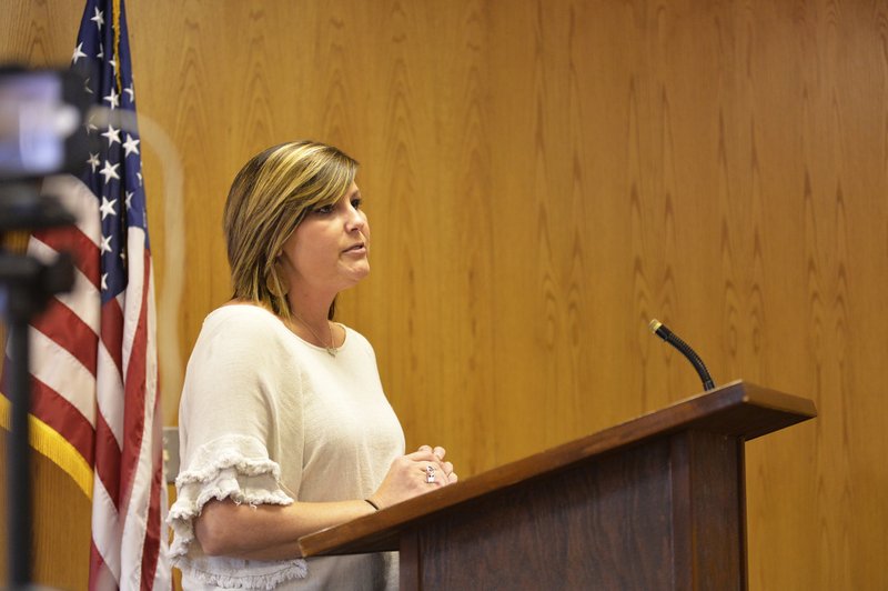 Ellie Baker, city director of economic development, informs the Magnolia City Council on details of a $150,000 grant proposal to help spur on a $2.375 million Amfuel and Department of Defense manufacturing deal. The grant was ultimately approved Thursday unanimously by the council.