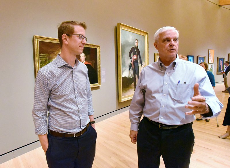 NWA Democrat-Gazette/FLIP PUTTHOFF U.S. Rep. Derek Kilmer (left), D-Wash., and Rep. Steve Womack, R-Rogers, tour Crystal Bridges Museum of American Art on Wednesday in Bentonville. Womack is hosting Kilmer and his wife, Jennifer, for their visit to the region after Womack toured Kilmer's district in September. The cross-party visits are designed to foster better relationships between the two parties, said John Richter with the Bipartisan Policy Center in Washington, D.C.