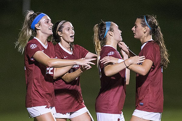 Arkansas players (from left to right) Parker Goins, Taylor Malham, Anna Podojil and Tori Cannata celebrate a goal during a game against Vanderbilt on Thursday, Sept. 26, 2019, in Fayetteville. 