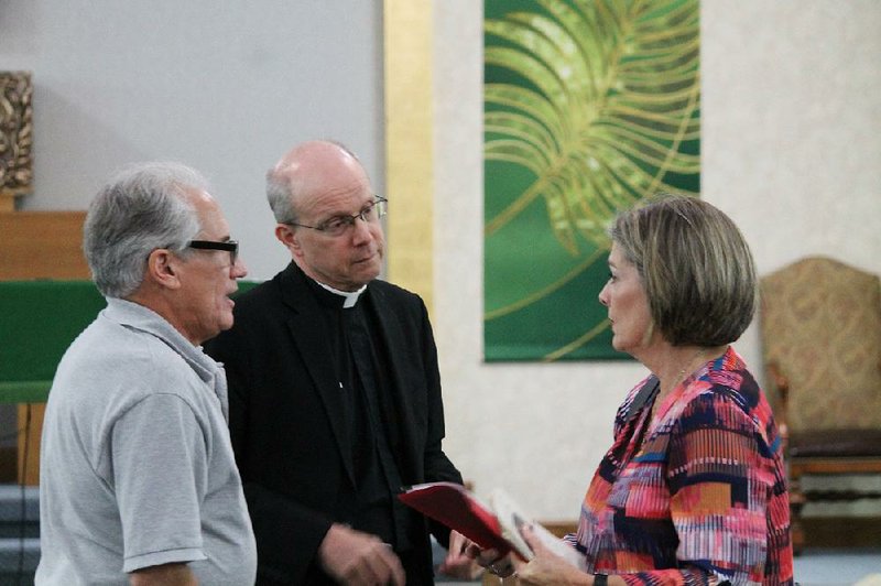 Miguel Prats (left), manager of the Maria Goretti Network, and the Rev. Gavin Vaverek, the network’s co-manager, speak with Diane Bausom of Conway at the St. Joseph Catholic Church in Conway on Sept. 27. Prats and Vaverek spoke about the self-help support organization for abuse survivors ahead of the debut of its first Arkansas chapter, set for next month.