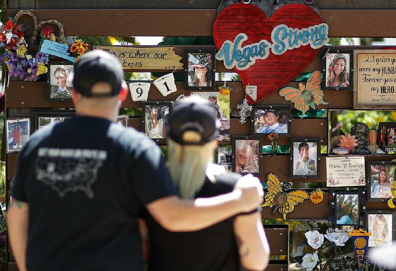 People visit a memorial garden for victims of a mass shooting in Las Vegas on Thursday, Oct. 3, 2019, in Las Vegas. (AP Photo/John Locher)