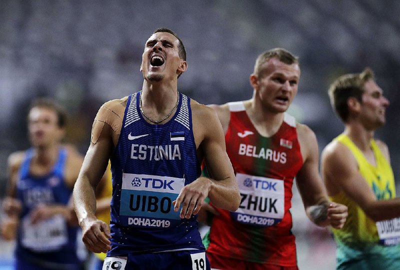 Maicel Uibo (left) of Estonia won the silver medal in the men’s decathlon at the Track and Field World Championships in Doha, Qatar, on Thursday. 