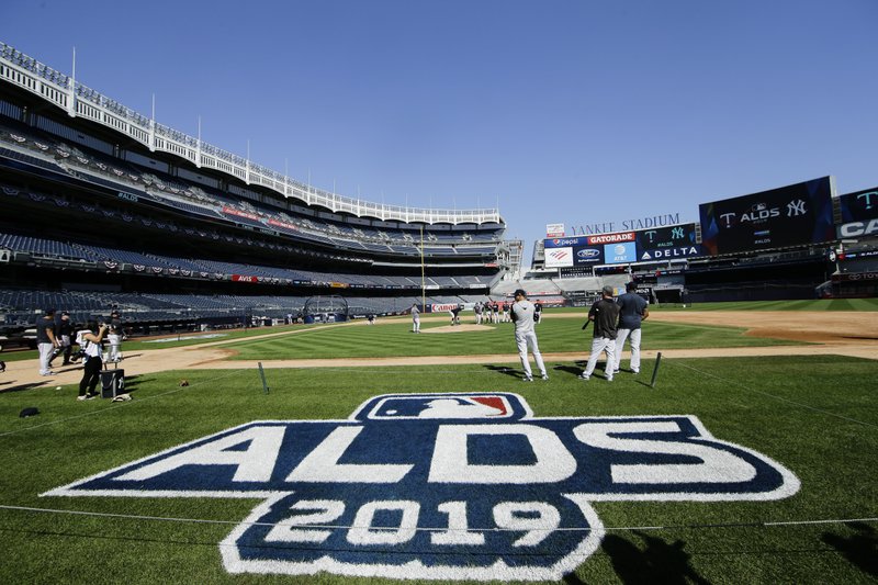 New York Yankees players warm up before a baseball team workout Wednesday, Oct. 2, 2019, at Yankee Stadium in New York. Yankees will host the Minnesota Twins in the first game of an American League Division Series on Friday. (AP Photo/Frank Franklin II)