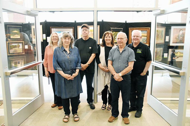 The Heart of America Artists’ Association’s Arkansas Territory Collection and Exhibition is on display at The Center for the Arts at Russellville High School. Area artists participating in the show are, front row, Gloria Garrison, left, and Bill Garrison; and back row, from left, Brenda Morgan, Doyle Young, Debbie Frame Weibler and Boyd Osborne.
