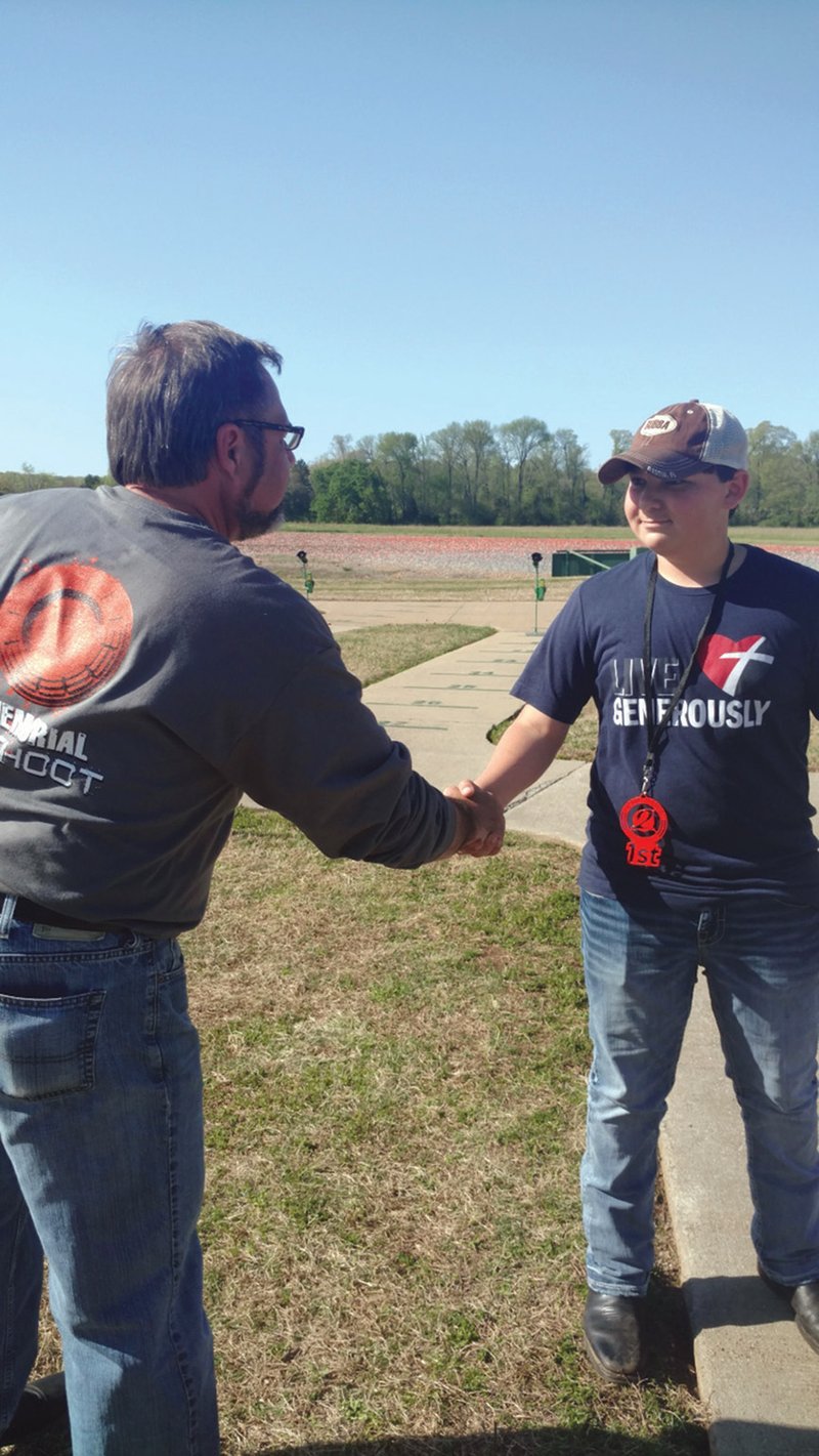 Bill Olson, left, congratulates Austin Davis for being named the high overall winner in the junior division at the O2 Shootout in April 2018. The shooting-sports tournament was named after Will Olson and Camdon Osborn, who died in a car accident in 2015. Austin was an avid shooter and was on the Batesville High School trap-shooting team. He died in May, and a scholarship has been established in his memory.