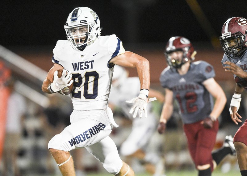 NWA Democrat-Gazette/CHARLIE KAIJO Bentonville West High School Nick Whitlatch (20) runs the ball for a score during a football game, Friday, October 4, 2019 at Springdale High School in Springdale.