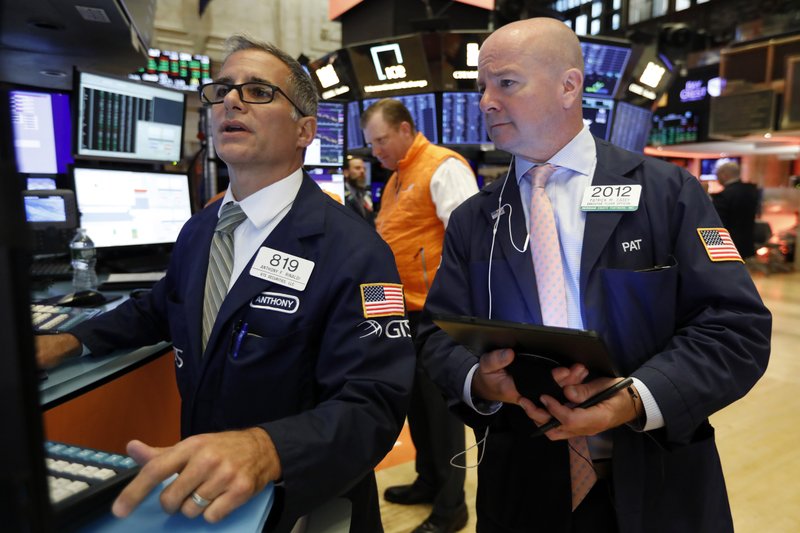  In this Sept. 13, 2019, file photo specialist Anthony Rinaldi, left, and trader Patrick Casey work on the floor of the New York Stock Exchange.  (AP Photo/Richard Drew, File)