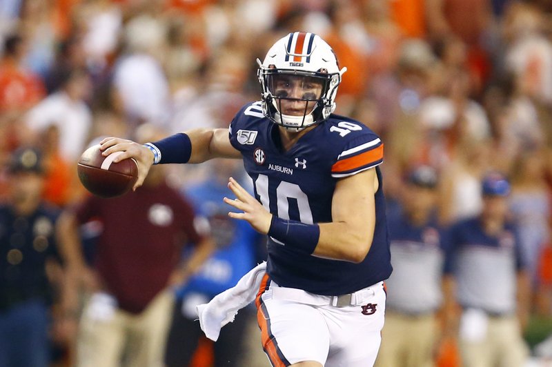 Auburn quarterback Bo Nix (10) rolls out to pass during the first half of an NCAA college football game against Mississippi State, Saturday, Sept. 28, 2019, in Auburn, Ala.