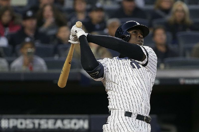 Didi Gregorius of the New York Yankees hits a grand slam during the third inning of the Yankees’ victory over the Minnesota Twins in Game 2 of their American League division series Saturday. 