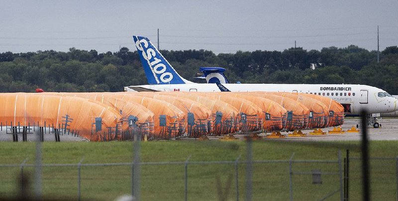 Completed Boeing 737 Max fuselages, made at Spirit AeroSystems in Wichita, Kan., sit covered in tarps this week near the factory. 