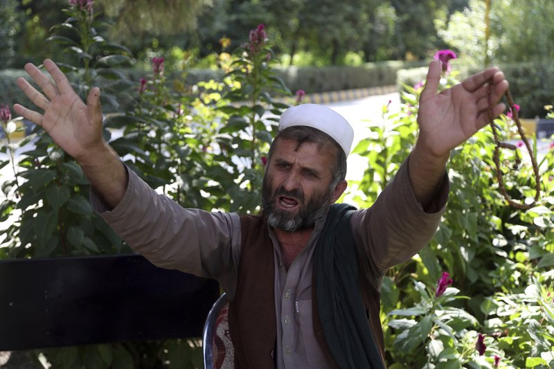 In this Tuesday, Oct. 1, 2019, photo, Mohammad Hasan, who lost seven members of his family, speaks during an interview to the Associated Press in Jalalabad city east of Kabul, Afghanistan, Eighteen years into this war and America would seem to be losing the battle for the “hearts and minds,” of Afghans as anger mounts over the numbers of civilians killed by U.S. and Afghan. (AP Photo/Rahmat Gul) story.lead_photo.caption