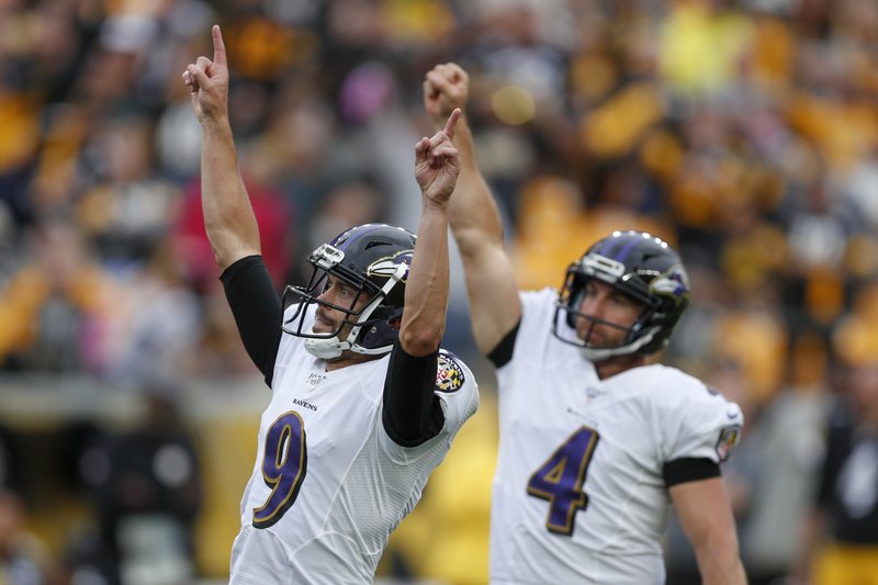 Baltimore Ravens kicker Justin Tucker (9) celebrates after making a game  winning field goal aga …