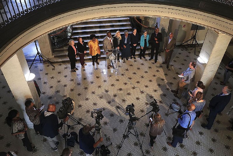 Mayor Frank Scott Jr. (at lectern) is joined by legislators, Arkansas Education Association officials and members of the Little Rock Board of Directors during his news conference at City Hall on Monday, Oct. 7, 2019.
