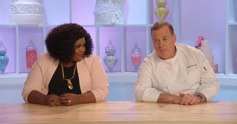 Comedian Nicole Byer serves as host and judges alongside James Beard Award-winning pastry chef Jacques Torres on Netflix's Nailed It! The show features amateur bakers as they attempt to replicate elaborately decorated masterpieces, often with disastrous results.