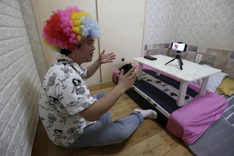 North Korean refugee Jang Myung-jin films himself in a demonstration of his YouTube broadcast during an interview at his house in Seoul, South Korea in this July photo. The 32-year-old Jang is among a handful of young North Korean refugees in South Korea who have launched YouTube channels that offer a rare glimpse into the everyday lives of people in North Korea, one of the world's most secretive and repressive countries. (Photo by Ahn Young-Joon via AP)