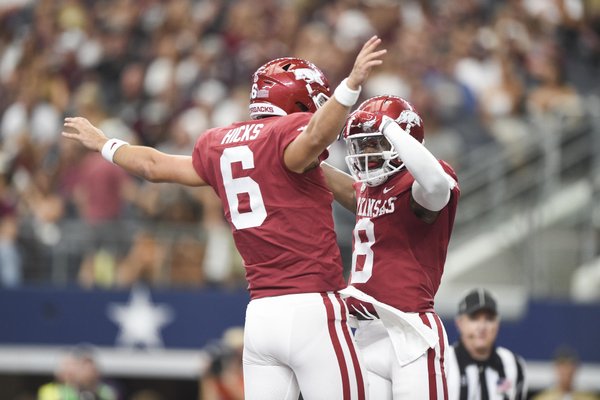 Arkansas Razorbacks wide receiver Mike Woods (8) reacts after a score during the second quarter of a football game, Saturday, September 28, 2019 at AT&T Stadium in Arlington, TX.
